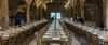 Pinglestone Barn at Christmas - a beautifully decorated barn featuring Christmas trees, fairy lights and long tables set up for a wedding