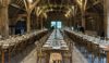 Pinglestone Barn at Christmas - a beautifully decorated barn featuring Christmas trees, fairy lights and long tables set up for a wedding