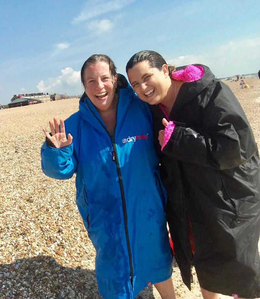 Sophie and Lucy pictured on a beach following a swim