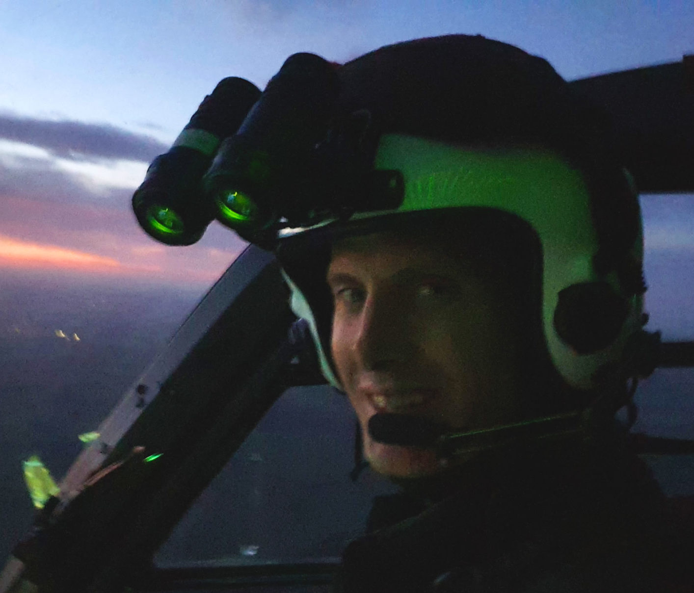 Pilot Jamie Anderson smiles to camera mid-flight