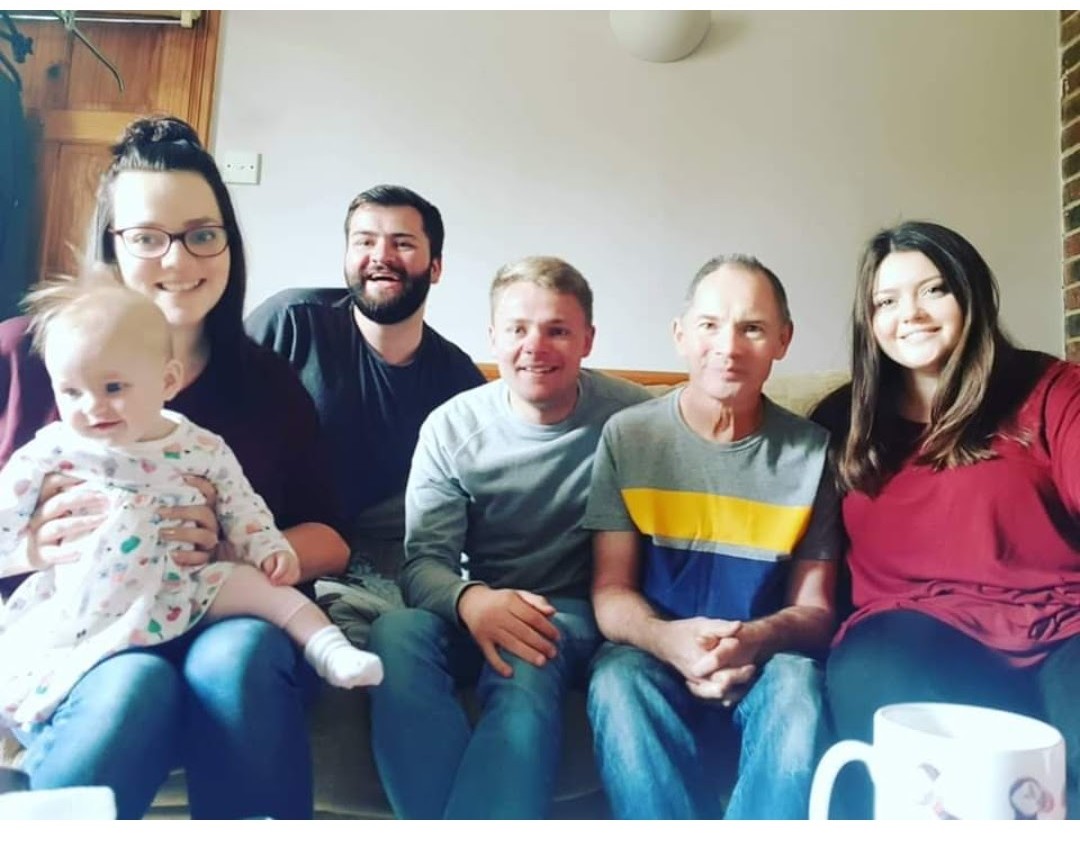 A group of people sat on a sofa