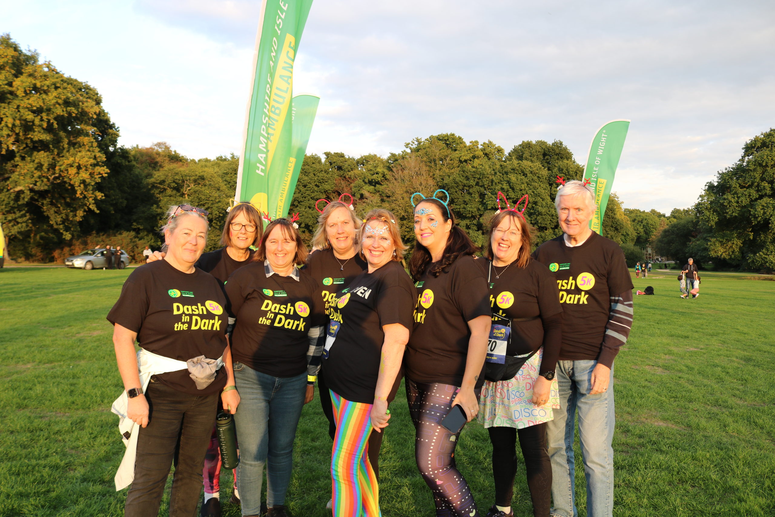 A group of people stood in a park