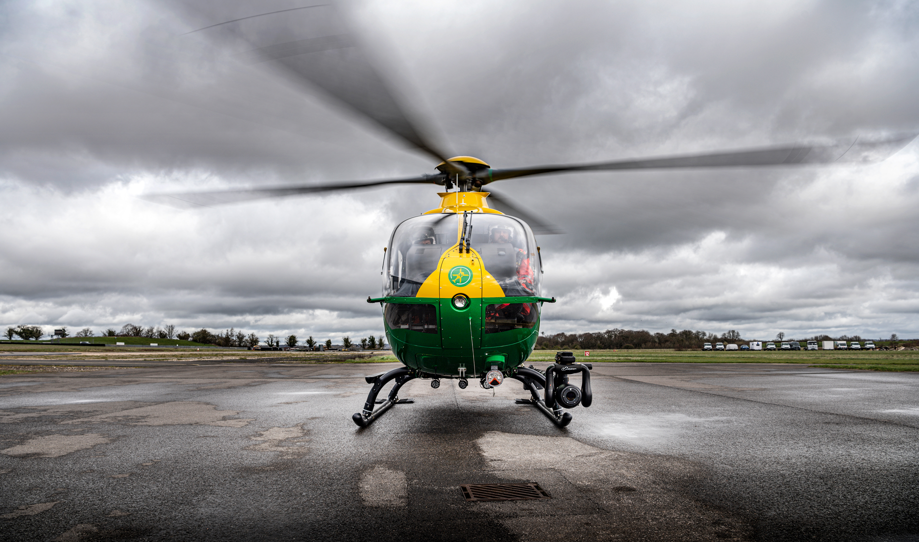 A helicopter with grey skies and low cloud