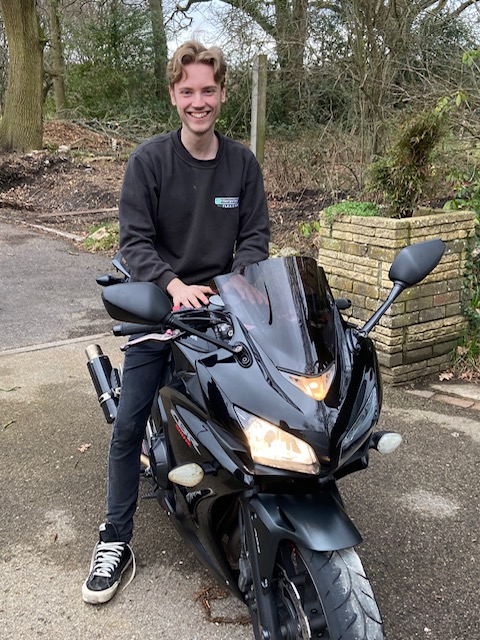 A man sat on a motorbike