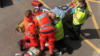 A team of paramedics working on a patient in a training simulation
