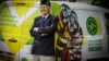 An RAF veteran stood with his arms crossed in front of an air ambulance branded charity van