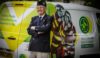 An RAF veteran stood with his arms crossed in front of an air ambulance branded charity van