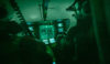 Inside the cockpit of a helicopter during a night flight