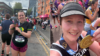 Two ladies holding up their Manchester and London Marathon medals, repsectively.