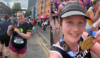 Two ladies holding up their Manchester and London Marathon medals, repsectively.