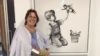 A lady stood next a Banksy painting wearing a hospital gown