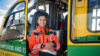 A paramedic sat in a helicopter holding her flight helmet.